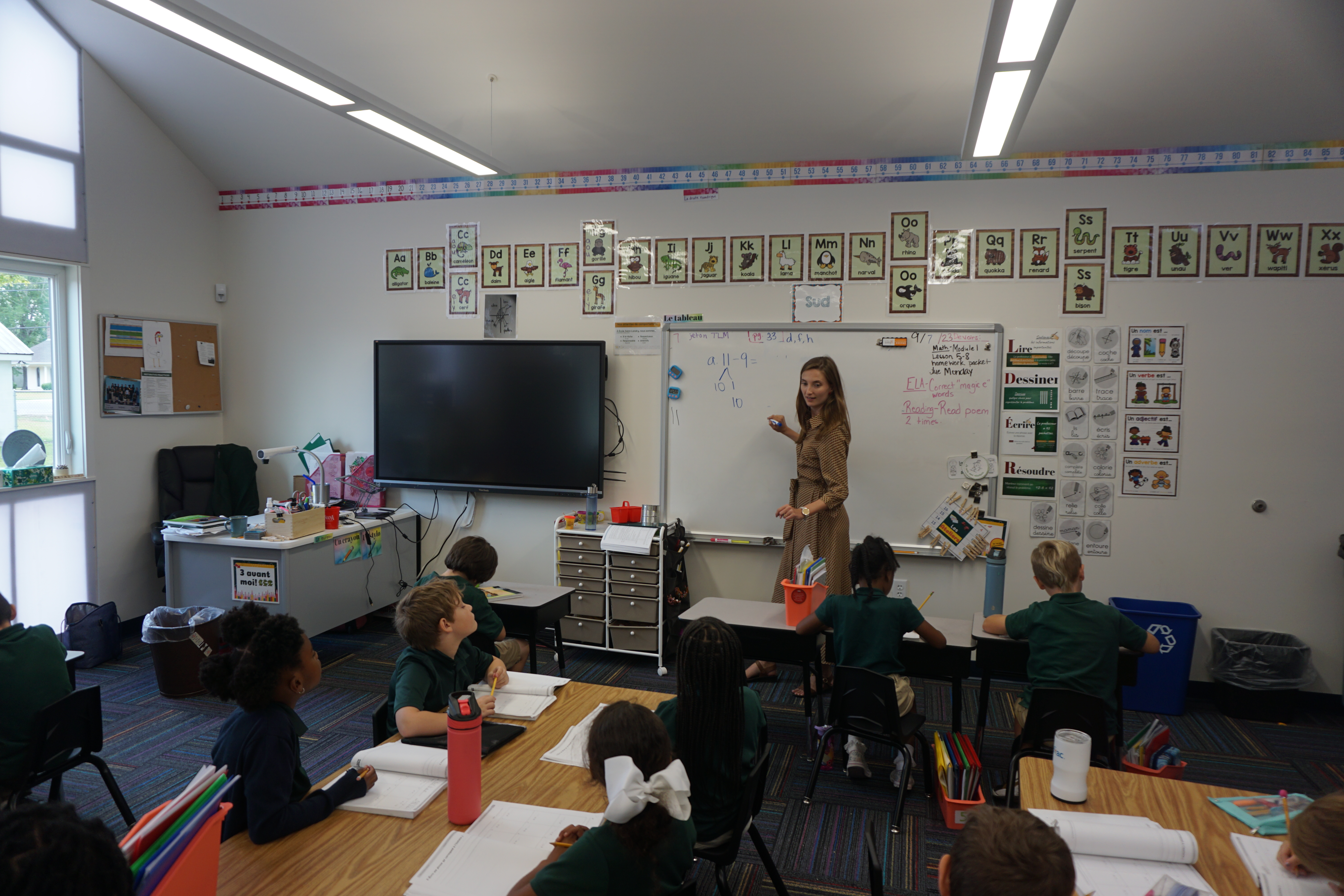 Escadrille program graduate teaching in her classroom